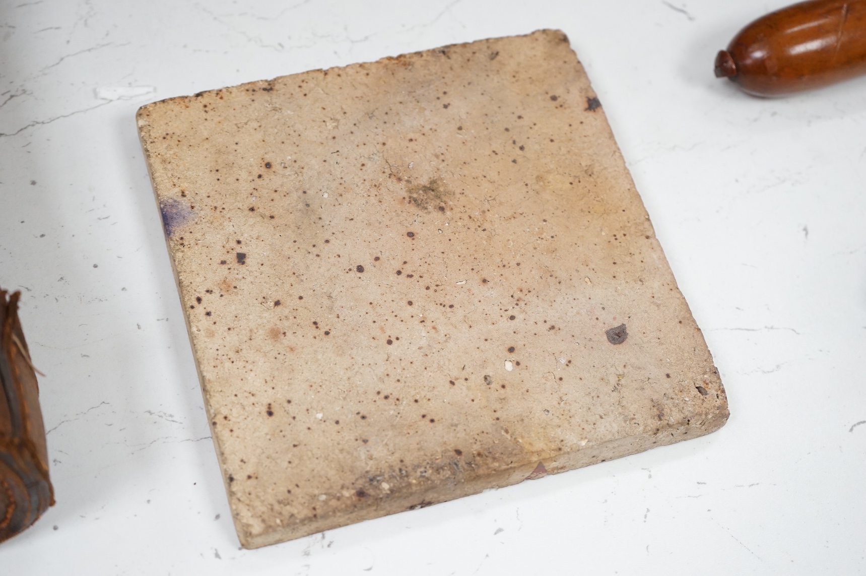 In the manner of William de Morgan, a Persian inspired experimental glazed tile, unmarked, 15cm wide